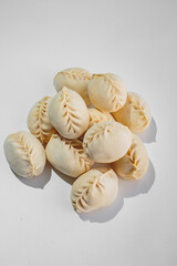 Dumplings with filling, frozen for cooking and frying