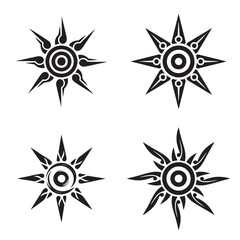 A black and white tribal-style sun symbol tatto with a spiral center