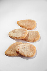 Dumplings with filling, frozen for cooking and frying