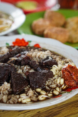 Indonesian soupy dish, captured on April 8, 2025. A rich and aromatic broth served with tender meat, vegetables, and local spices, offering comforting and traditional flavors