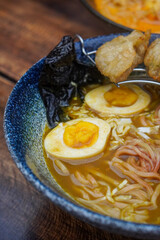 Indonesian-style ramen, captured on April 8, 2025. A savory noodle dish with rich broth, tender...