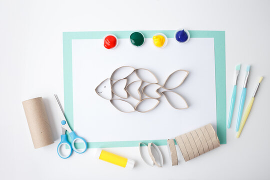 Craft education concept for eco product brands, toy companies, children classes, and early learning centers. Cardboard painting activity showing reuse and color learning.