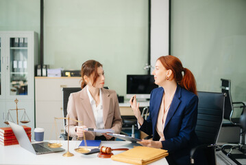  business team and lawyers discussing contract papers sitting at the table. Concepts of law, advice, legal services.