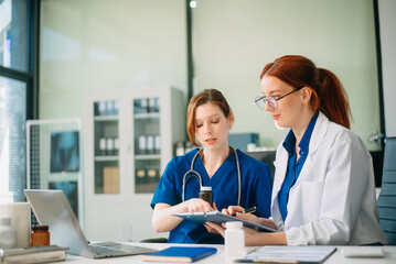Medical team in hospital using digital tablet for diagnosis, teamwork, and patient care doctor and nurse collaboration
