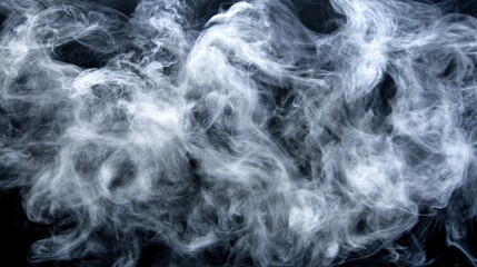 Fototapeta premium White smoke swirls against a dark background creating an abstract pattern.