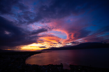 Sunset Over Coastal City and Sea in Greece