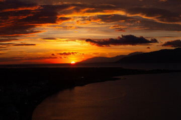 Sunset Over Coastal City and Sea in Greece
