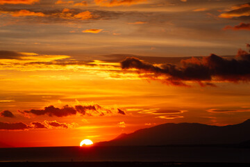 Sunset Over Coastal City and Sea in Greece