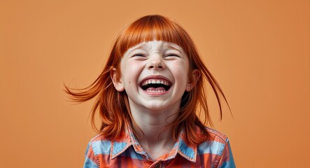 redhead kid girl on orange plain bright background happy laughing hysterical looking at camera portrait banner with copy space ad concept marketing