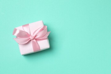 Beautiful gift box on color background