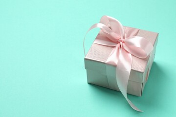 Beautiful gift box on color background