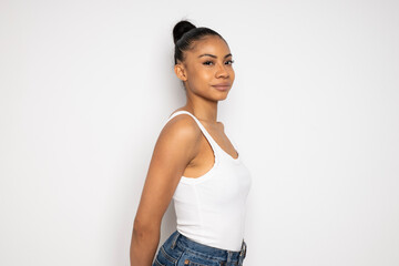 Fashionable woman posing in studio with white background