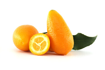 Fresh kumquats with leaf and a half fruit showing the pulp