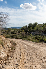 Beautiful scenery with winding gravel dirt road, Costa Blanca , Alicante, Spain - stock photo