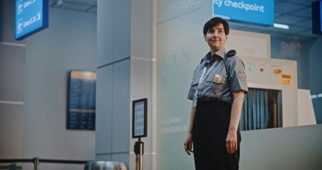 Flight Crew in Airport Terminal: Mature Airline Pilot and Two Beautiful Flight Attendants in...