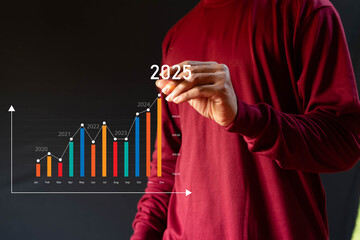 Business Growth in 2025Businessman analyzes economic trends for long-term investment in 2025, sets...