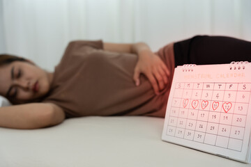 stomach ache. Asian women have abdominal pain, indigestion, gastritis, menstrual cramps,...