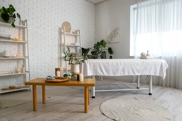 Interior of spa salon with couch and table