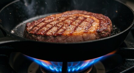 Meat is currently being cooked in a frying pan placed on a stove