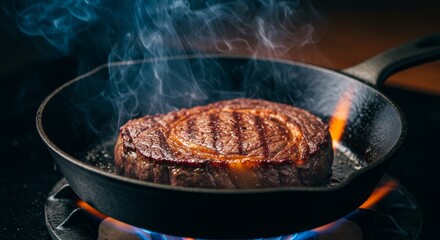 Meat is currently being cooked in a frying pan placed on a stove