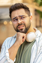 Sad unhappy young man tourist thinks over life concerns, suffers from unfair situation. Problem,...