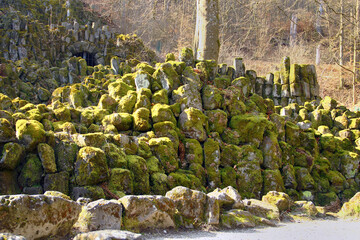 Moss-Covered Basalt Columns and Stream in a Forest Landscape