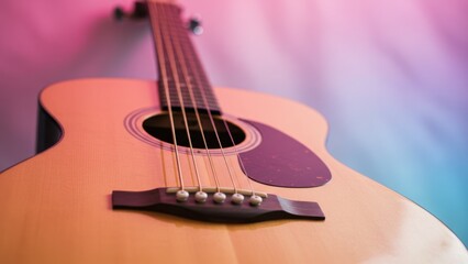 Fototapeta premium Close-up of a guitar with pink and blue hues adding a musical, artistic feel.