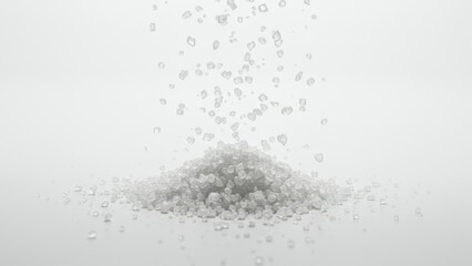 A pile of sugar with sugar granules falling down from above it.