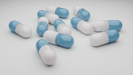 複数の散らばっている薬のカプセルのイメージ　3D・レンダリング　青／ブルー