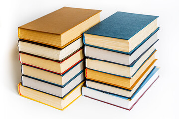 stack large pile of printed literary old books lies on table book covers and pages for study book...