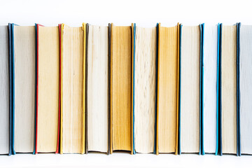 stack a large pile of printed books lies on the table, book covers and pages for study