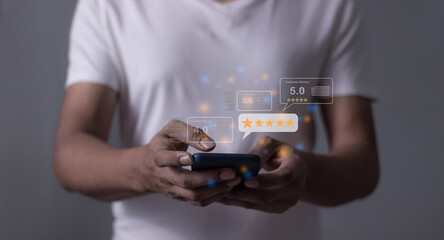 Customer Review, Young Man hand holding Smart Phone with five star to review and give 5 stars with very good results in service, Good review 5 star rating choice feedback