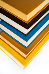 stack a large pile of printed books lies on the table, book covers and pages for study