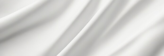 White fabric with soft folds and shadows creating a smooth texture. Clean and modern background for wedding design background or beauty design.