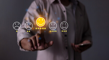 Happy Customer, Young Man with Smart Phone hand touching five star to review and give 5 stars with very good results in service, Good review 5 star rating choice feedback