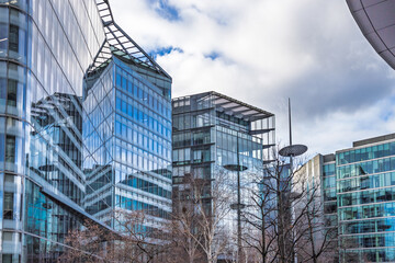 Contemporary urban architecture with mirrored glass facades in city center
