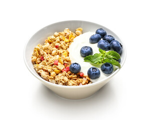 Bowl of tasty granola with yogurt on white background