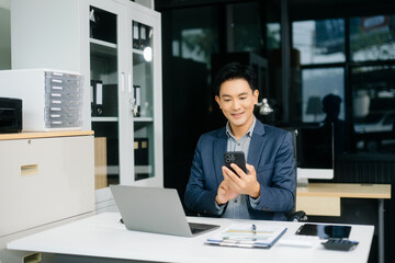 Obraz premium Man freelancer is working her job on computer tablet and laptop Doing accounting analysis report real estate