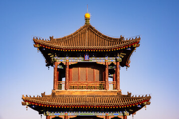 Old wall in Xian, China with traditional towers and red lanterns