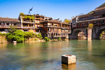 Fenghuang ancient town, China. Traditional chinese wooden houses in old watertown