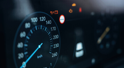 Vehicle is parked. Detailed close up view of speedometer, front panel