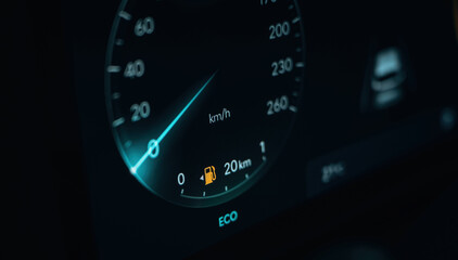 Dark and blue colors. Detailed close up view of speedometer, front panel