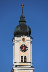 Clock tower in front of blue sky