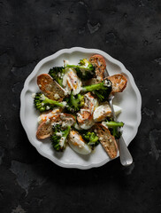 Alternative caesar salad with broccoli on a dark background, top view