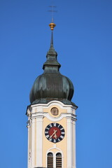 Clock tower in front of blue sky