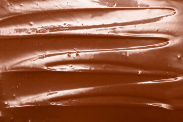 Delicious melted milk chocolate as background