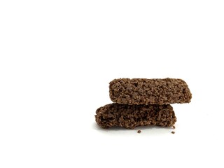 Crispy chocolate oat snack bars with rough texture, healthy and crunchy, isolated on white background. Perfect for food advertising, packaging, and healthy lifestyle concepts