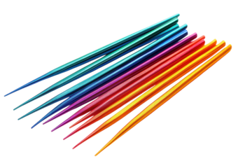 Vibrant rainbow knitting needles a colorful collection of metal sharp points isolated on white isolated on transparent background