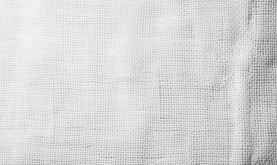 Detailed shot of a clean, sterile white gauze fabric commonly used for medical purposes.