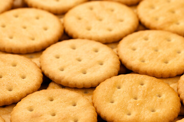 Macro shot of round salty cracker cookies. Snacks. Beer snack. 